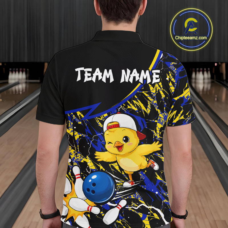 Person wearing a colorful bowling-themed shirt with a cartoon chicken character in a bowling alley.