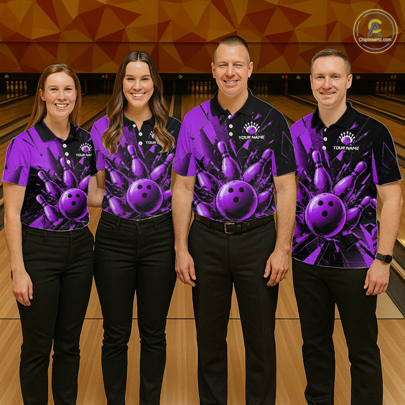 Four people standing together in a bowling alley wearing matching custom-designed bowling shirts with a purple and black bowling ball and hand graphic, paired with black pants.