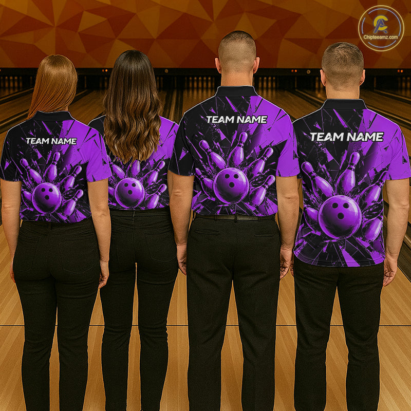Four people standing from the back in a bowling alley, wearing matching purple and black bowling-themed shirts with bowling ball graphics and white 'TEAM NAME' text.