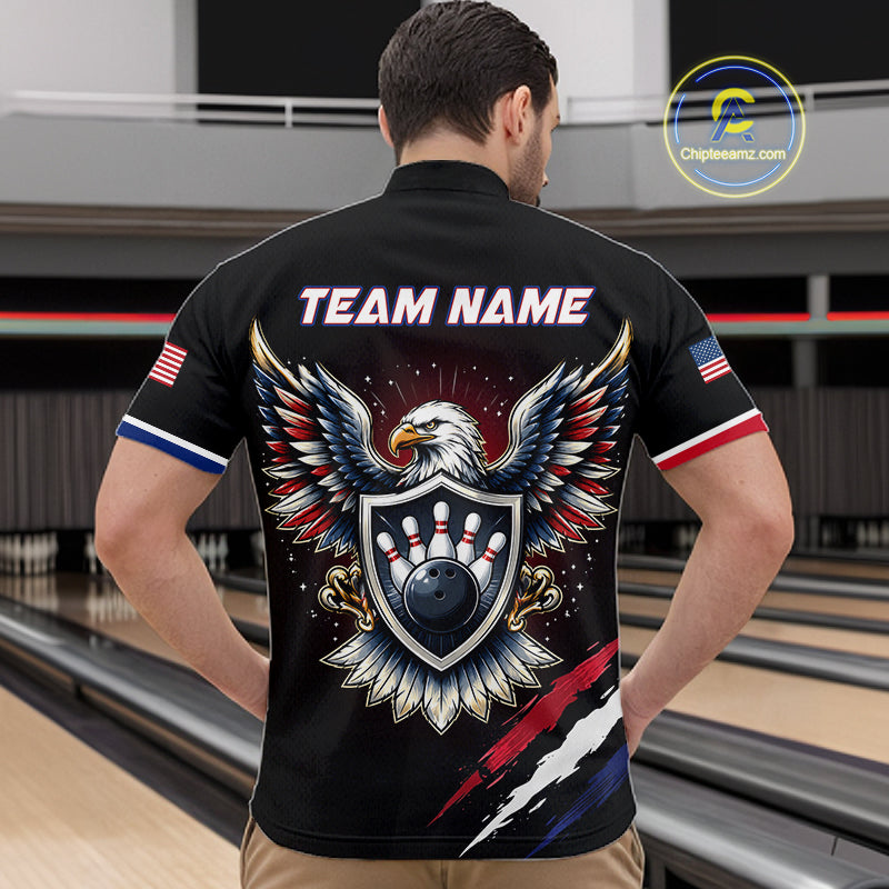 Person wearing a black bowling shirt with an eagle design and 'Team Name' text on the back, standing in a bowling alley.