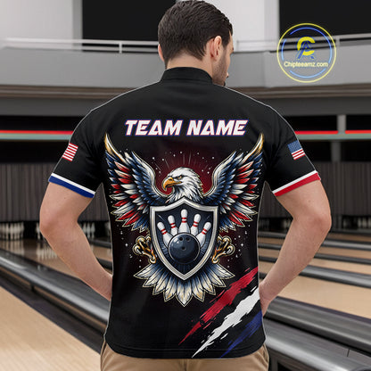 Person wearing a black bowling shirt with an eagle design and 'Team Name' text on the back, standing in a bowling alley.