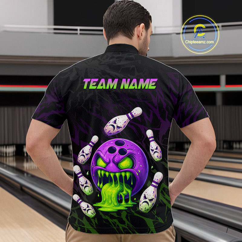 Person wearing a black bowling shirt with colorful design and 'TEAM NAME' text at a bowling alley.