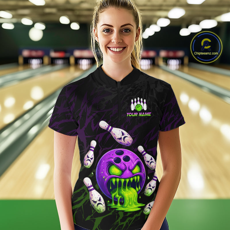 Person wearing a custom bowling shirt with a colorful design in a bowling alley.