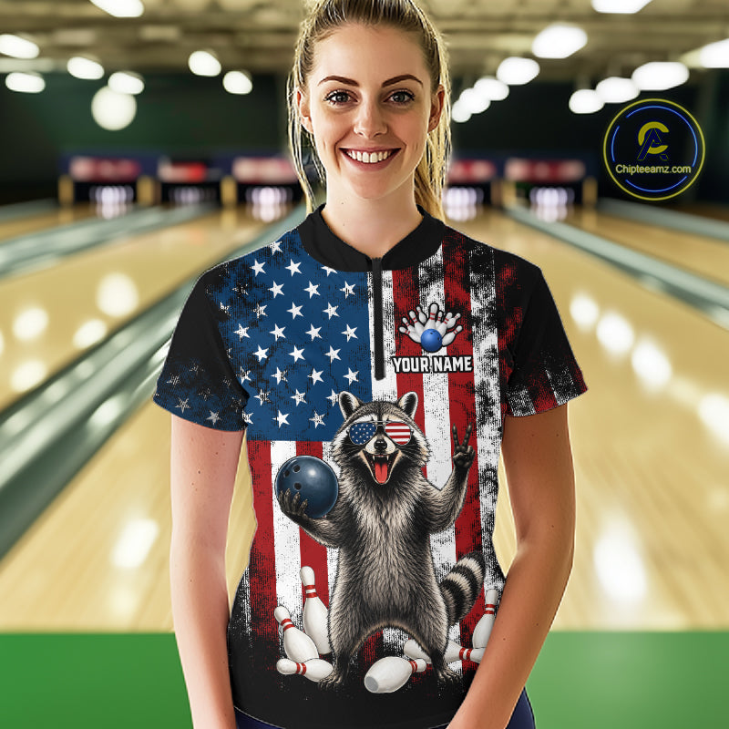 Women’s us flag raccoon bowling quarter zip shirt, front view on female model in bowling lane 