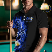 Load image into Gallery viewer, Man wearing a black polo shirt with a blue graphic design and pool cue in a billiards setting.