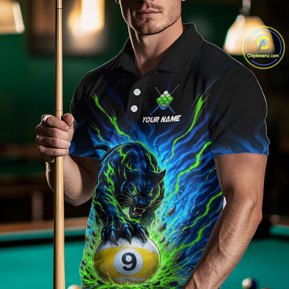 Person wearing a black polo shirt with a panther and pool ball design, holding a pool cue in a billiards setting.