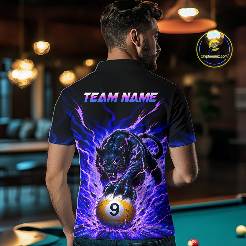 Person wearing a shirt with a panther and pool ball design, standing in a bar.