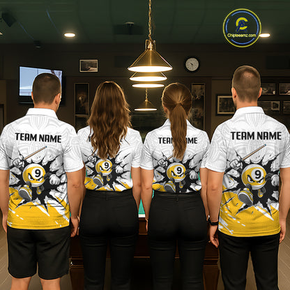 Four people wearing matching billiard team shirts in a billiard alley.