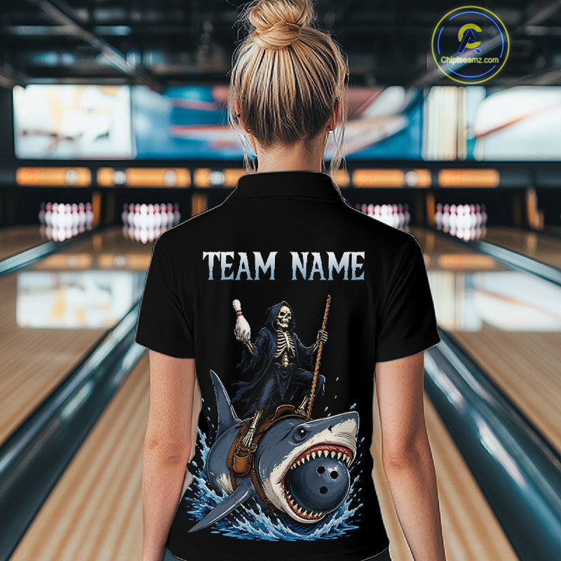 A woman viewed from behind wearing a black short-sleeve polo shirt with a large back graphic. The graphic shows a skeleton riding a shark with a bowling pin and bowling ball, with the text 'TEAM NAME' above.