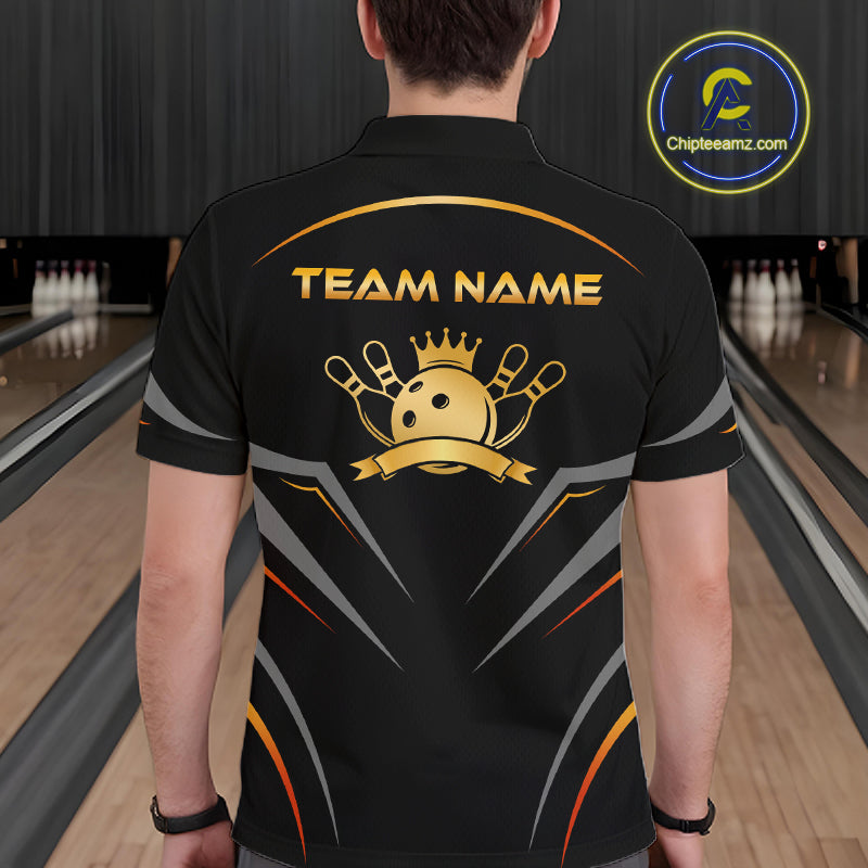Person wearing a black bowling shirt with 'Team Name' and logo in a bowling alley.