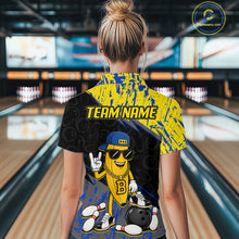 Load image into Gallery viewer, Women polo wearing a bowling shirt with a cartoon character and 'TEAM NAME' text in a bowling alley.