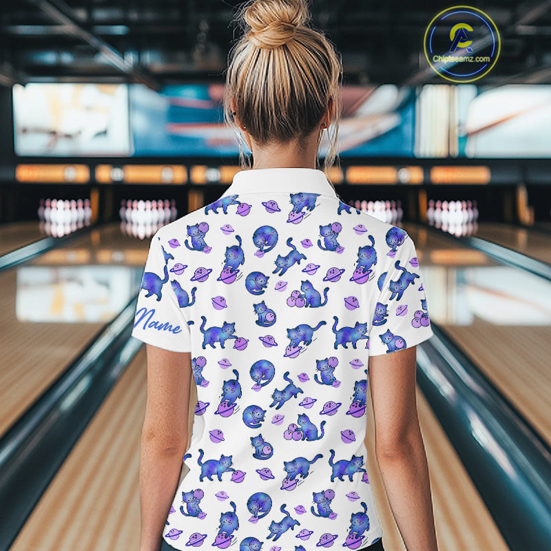 Women wearing a white shirt with cat pattern in a bowling alley.