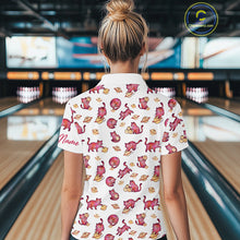 Load image into Gallery viewer, Women wearing a colorful shirt with cat patterns in a bowling alley.