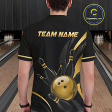 Load image into Gallery viewer, Person wearing a black and gold bowling shirt with 'TEAM NAME' text in a bowling alley.