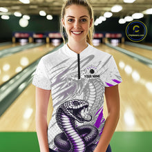 Load image into Gallery viewer, Woman wearing a white t-shirt with a snake design in a bowling alley