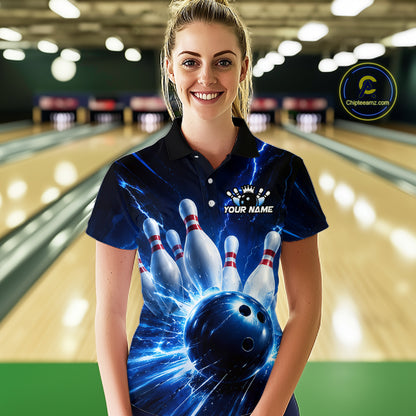 Woman wearing a black and blue bowling polo shirt featuring lightning effects, a large blue bowling ball striking pins, and custom player name text.