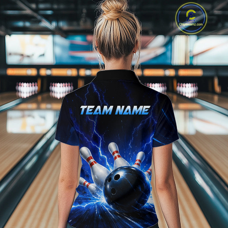 Woman wearing a black and blue bowling polo shirt featuring lightning effects, a large blue bowling ball striking pins, and custom team name text.
