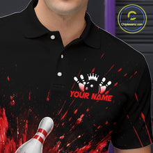 Load image into Gallery viewer, Man wearing a black bowling quarter zip shirt with dramatic red splatter graphics, a large black bowling ball, and flying pins, plus custom player name text.