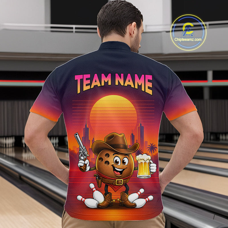 A man viewed from behind wearing a short-sleeve collared shirt with a large colorful back graphic. The shirt has a dark navy-to-orange gradient, the text 'TEAM NAME' in pink/yellow, and a cartoon cookie character in a cowboy hat holding a revolver and a beer mug against a sunset and bowling alley scene.