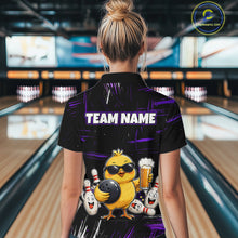 Load image into Gallery viewer, Women wearing bowling quarter zip shirt featuring a chick holding a bowling ball surrounded by smiling pins and beer graphics on black yellow background.