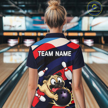 Load image into Gallery viewer, Person wearing a navy, red, and white bowling quarter zip featuring a cartoon pug holding a purple bowling ball, pins, and custom team text.