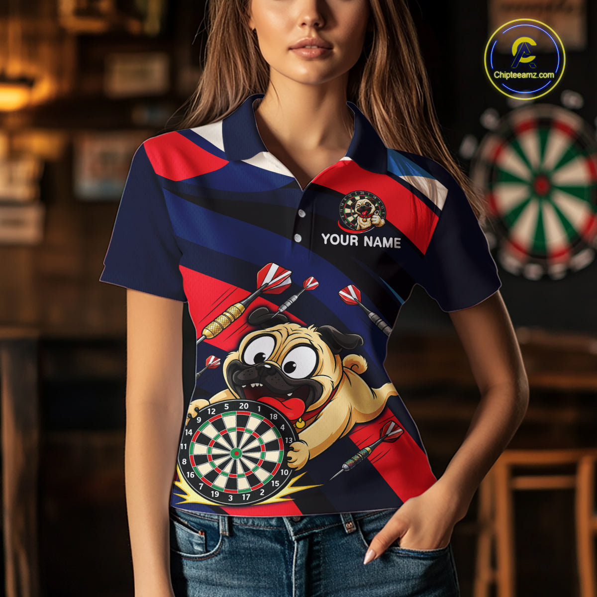 Person wearing a navy, red, and white darts polo featuring a cartoon pug holding a dartboard, flying darts, and custom team text.
