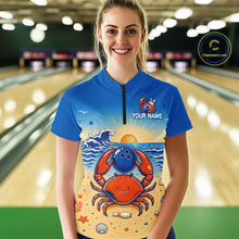 Load image into Gallery viewer, Person wearing a blue shirt with a colorful design of a crab and ocean elements, standing in a bowling alley.