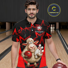 Load image into Gallery viewer, Man wearing a black and red shirt with a cartoon sheep holding a bowling ball and pins in a bowling alley.
