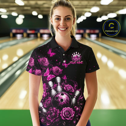 Women’s pink rose butterfly bowling polo shirt, front view on female model in bowling lane 