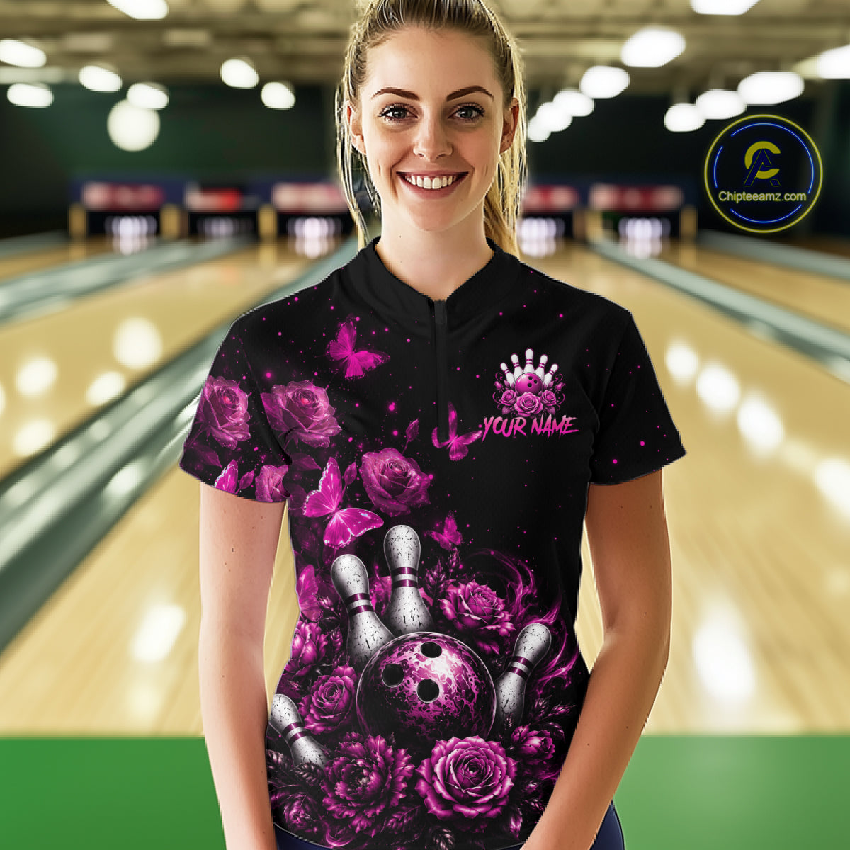 Women’s pink rose butterfly bowling quarter zip shirt, front view on female model in bowling lane 