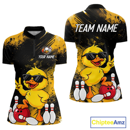 Front and back views of a women's short-sleeve polo shirt featuring a cartoon yellow duck wearing black sunglasses, bowling with red bowling balls and white pins, on a black and yellow splatter background. The front has placeholder text 'YOUR NAME' and a small mascot logo, while the back has 'TEAM NAME' in white.