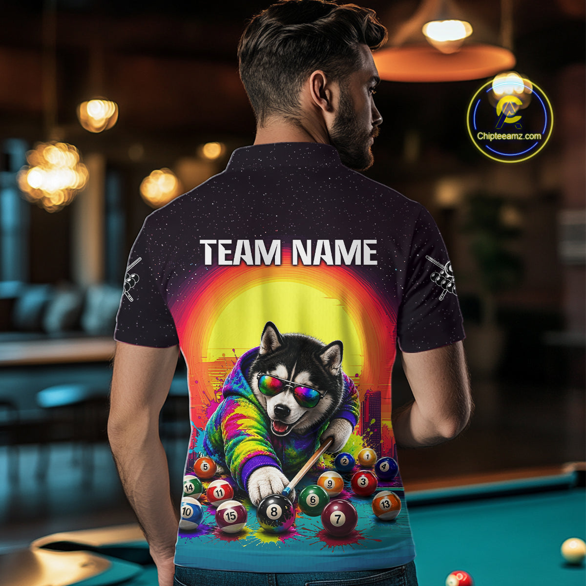Person wearing a shirt with a colorful design of a dog playing pool, with 'TEAM NAME' text.