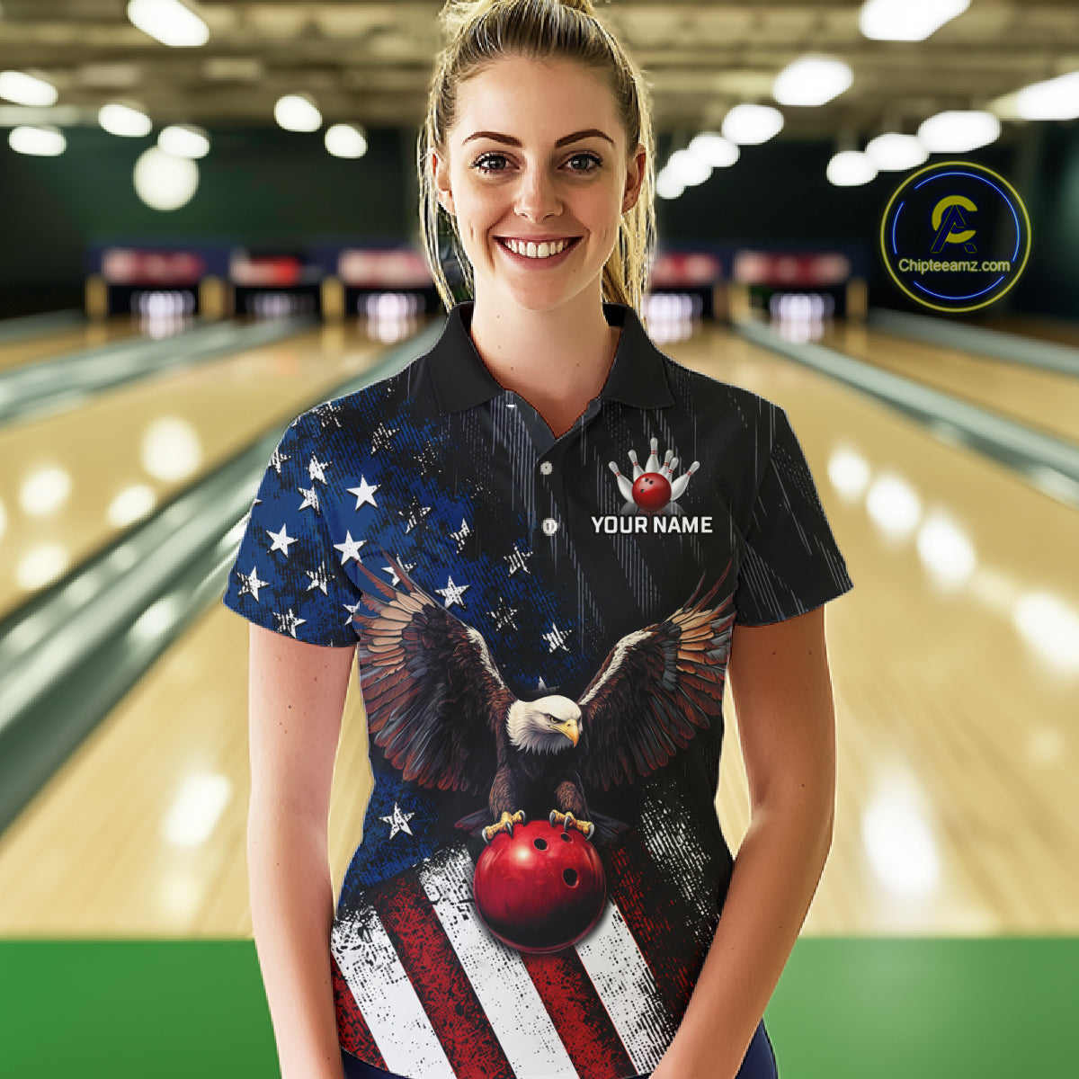 A woman stands in a bowling alley wearing a custom short-sleeve polo shirt with a patriotic American flag design, featuring a bald eagle holding a red bowling ball and the text 'YOUR NAME' on the chest. A circular 'Chipkeeenz.