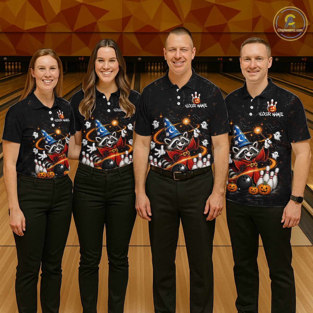 Four people standing in a bowling alley wearing matching black short-sleeve polo shirts with a colorful Halloween-themed graphic print featuring a raccoon, witch hat, pumpkins, and white pins. The shirts also have 'YOUR WAVE' printed on the chest.