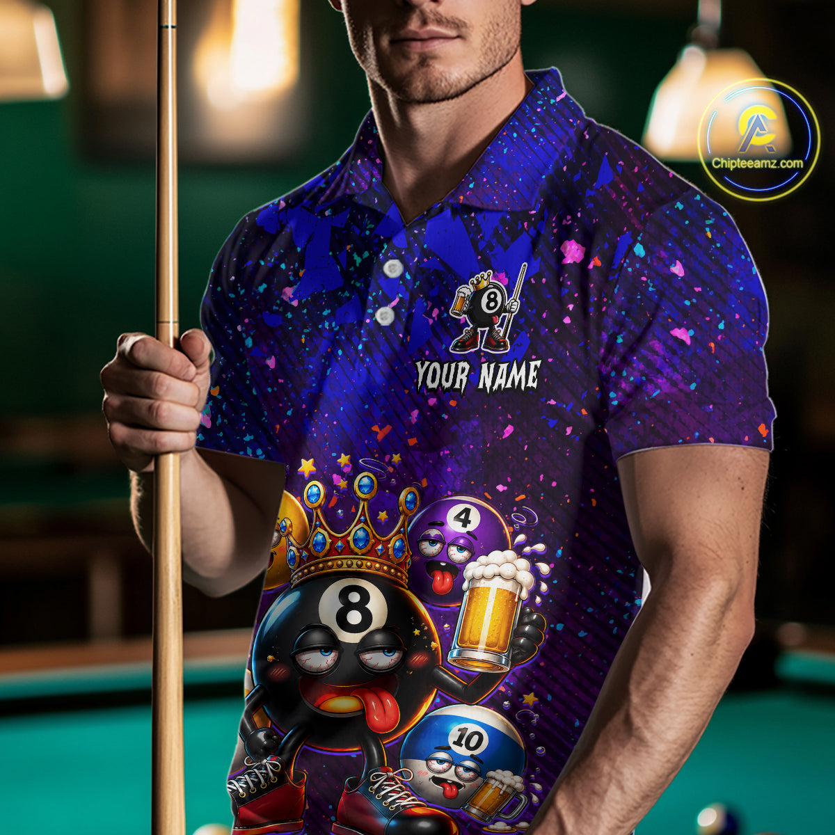 A man holding a pool cue wearing a custom blue and purple polo shirt with a 8-ball themed cartoon graphic and the text 'YOUR NAME'.