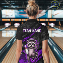 Load image into Gallery viewer, Person wearing a bowling shirt with a raccoon graphic and 'TEAM NAME' text in a bowling alley.
