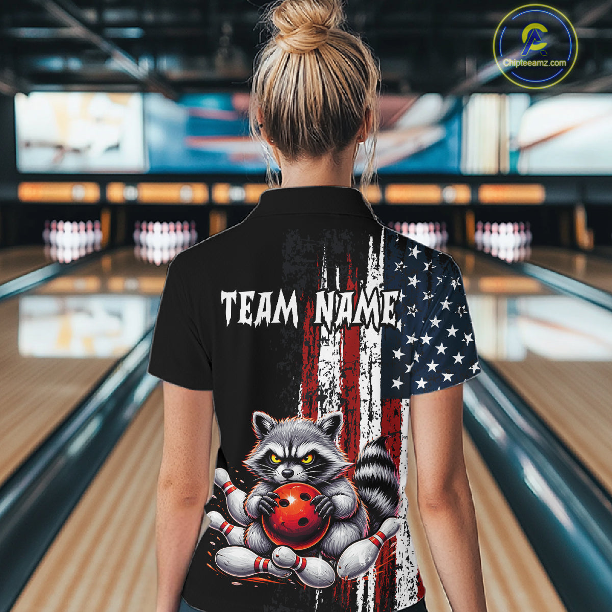 Women’s us flag raccoon bowling polo shirt, back view on female model in bowling lane 