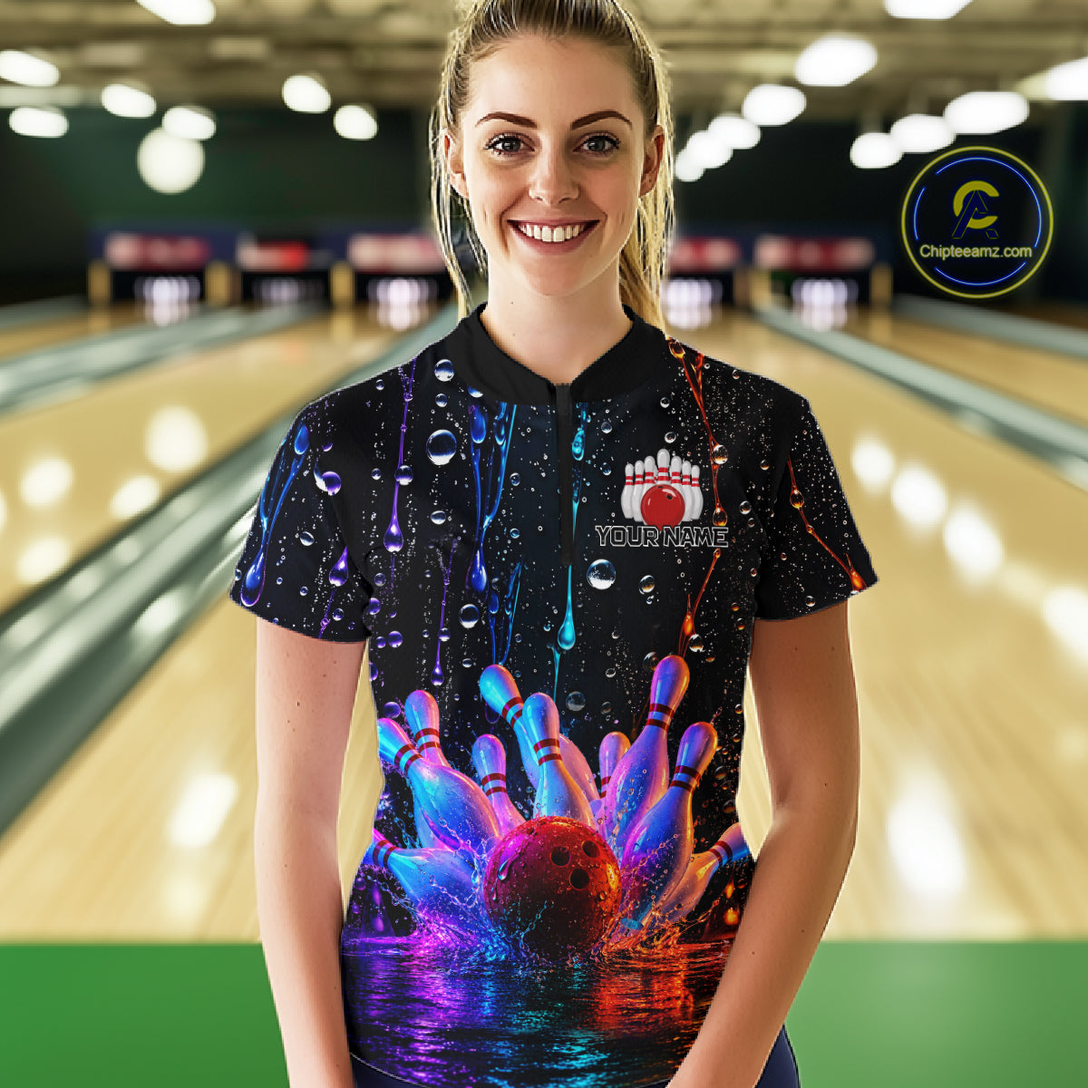 Women wearing a colorful bowling shirt with a bowling ball design in a bowling alley.
