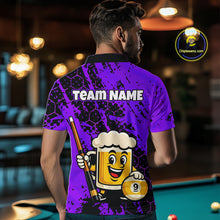 Load image into Gallery viewer, Man wearing a blue funny beer with a cartoon beer mug and pool cue design, standing in a bar.