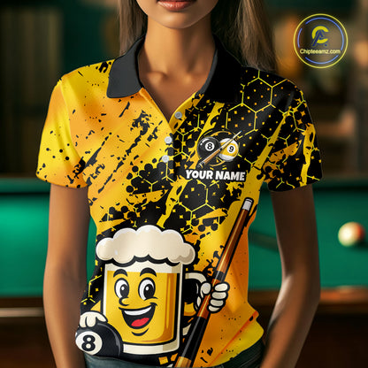 Woman wearing a bright yellow billiards polo with black splatter graphics, custom “YOUR NAME” text, and a smiling beer mug mascot holding a pool cue.
