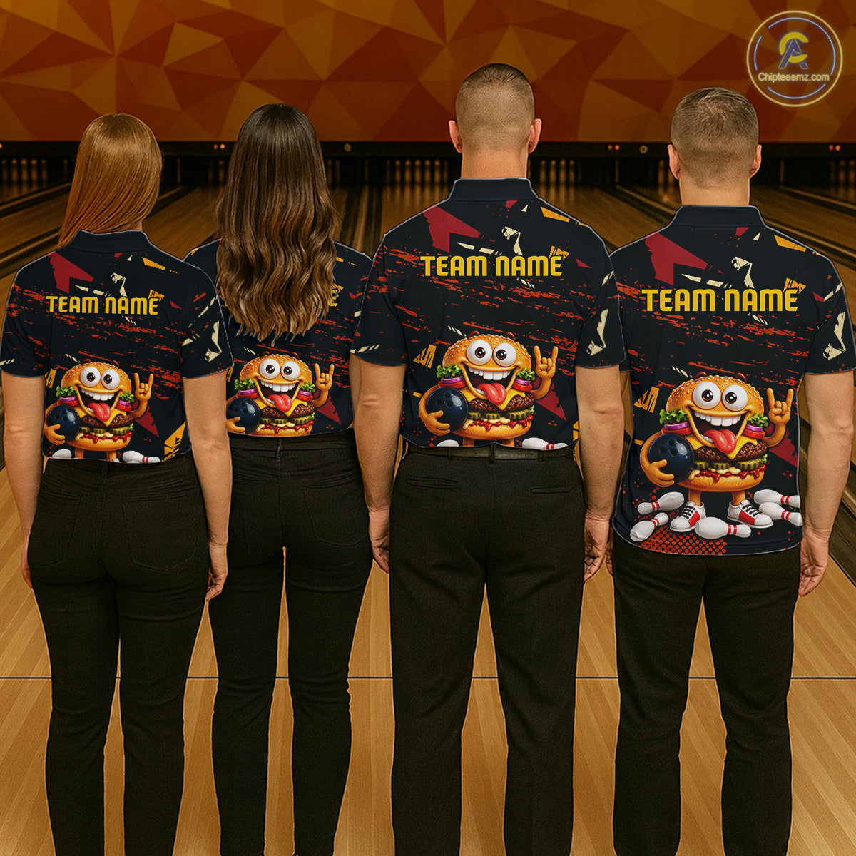Four people standing with their backs to the camera in a bowling alley, wearing matching dark navy bowling shirts with a colorful cartoon character graphic and 'TEAM NAME' text on the back.