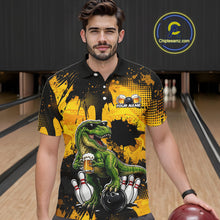 Load image into Gallery viewer, Man wearing a black bowling polo featuring a green T-Rex wearing sunglasses, holding a beer mug, standing with bowling pins and a bowling ball, plus personalized name and team name text.