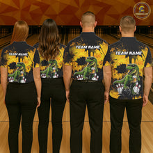 Load image into Gallery viewer, Four people wearing bowling polo shirt featuring a dinosaur holding beer with bowling pins and ball artwork on black yellow background.