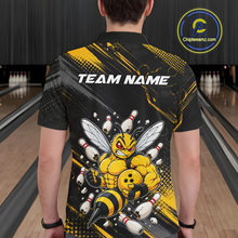 Load image into Gallery viewer, Man wearing bowling polo shirt featuring a muscular bee holding a bowling ball surrounded by pins on black yellow background.