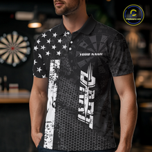 Load image into Gallery viewer, Man wearing darts polo shirt featuring dartboard patterns layered with american flag graphics and geometric details on a black background.