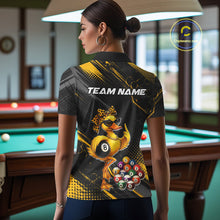 Load image into Gallery viewer, Women wearing billiards polo shirt featuring a duck holding an eight ball with pool balls arranged across a black yellow background.