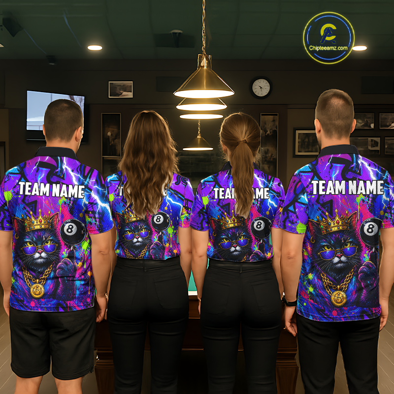 Four people standing with their backs to the camera in a billiards room, wearing matching custom-printed jerseys featuring a purple and blue cat with a gold crown and 8-ball design, with 'TEAM NAME' printed on the back.