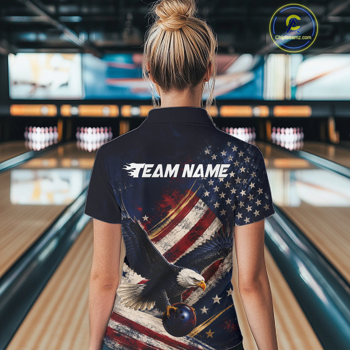 Women’s us flag eagle bowling quarter zip shirt, back view on female model in bowling lane 