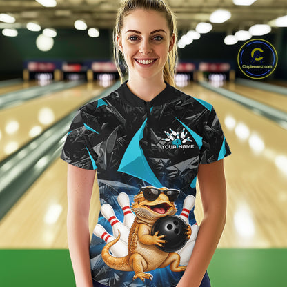 Women’s turquoise bearded dragon bowling quarter zip shirt, front view on female model in bowling lane 