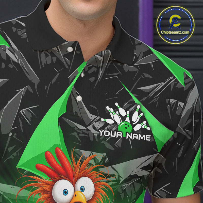 A close-up of a person wearing a black short-sleeve polo shirt with a green and gray abstract pattern, a bowling pin graphic with the text 'YOUR NAME', and a cartoon bird character at the bottom. A circular 'ChipteeAmz.